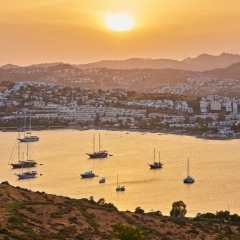 Panoramic Sunset view of Gumbet bay in Bodrum on Turkish Riviera. Bodrum is a district and a port city in Mugla Province, in the southwestern Aegean Region of Turkey